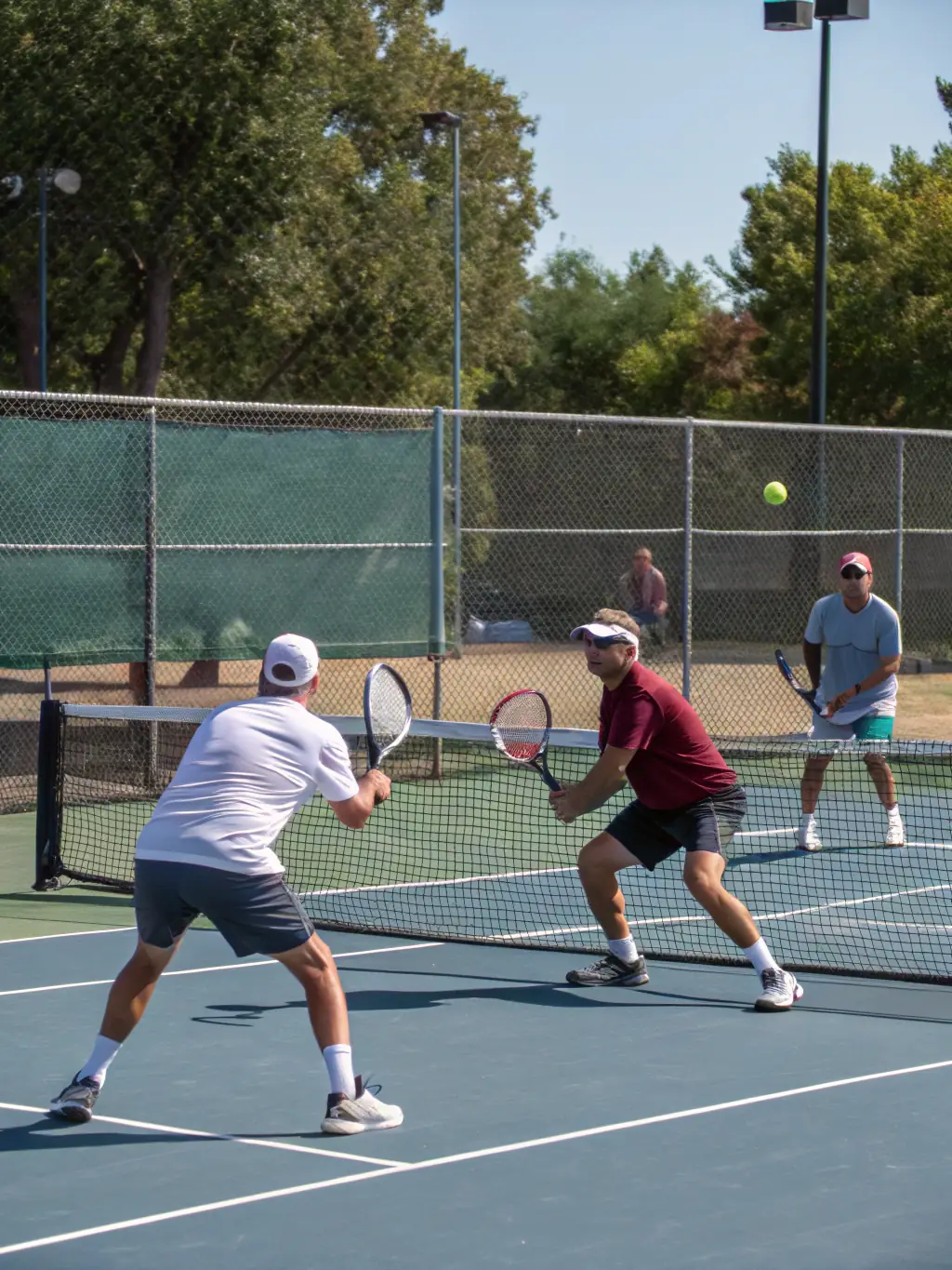 A vibrant image of club members participating in a friendly doubles match on a sunny day, showcasing the social aspect of TENNIS CLUB VICOIS.